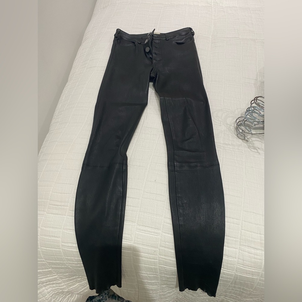 High rise black skinny leather (100% lamb skin) pants. Size 0. Worn Twice.